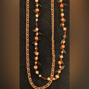 Cookie Lee strands: faux pink pearls, brown ribbon; gold-toned braided chain.